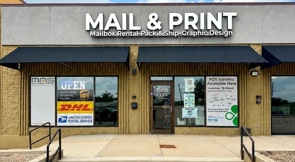 The storefront at MAS Mail & Print Center in Rockford, with UPS, DHL and United States Postal Service signs in the window.